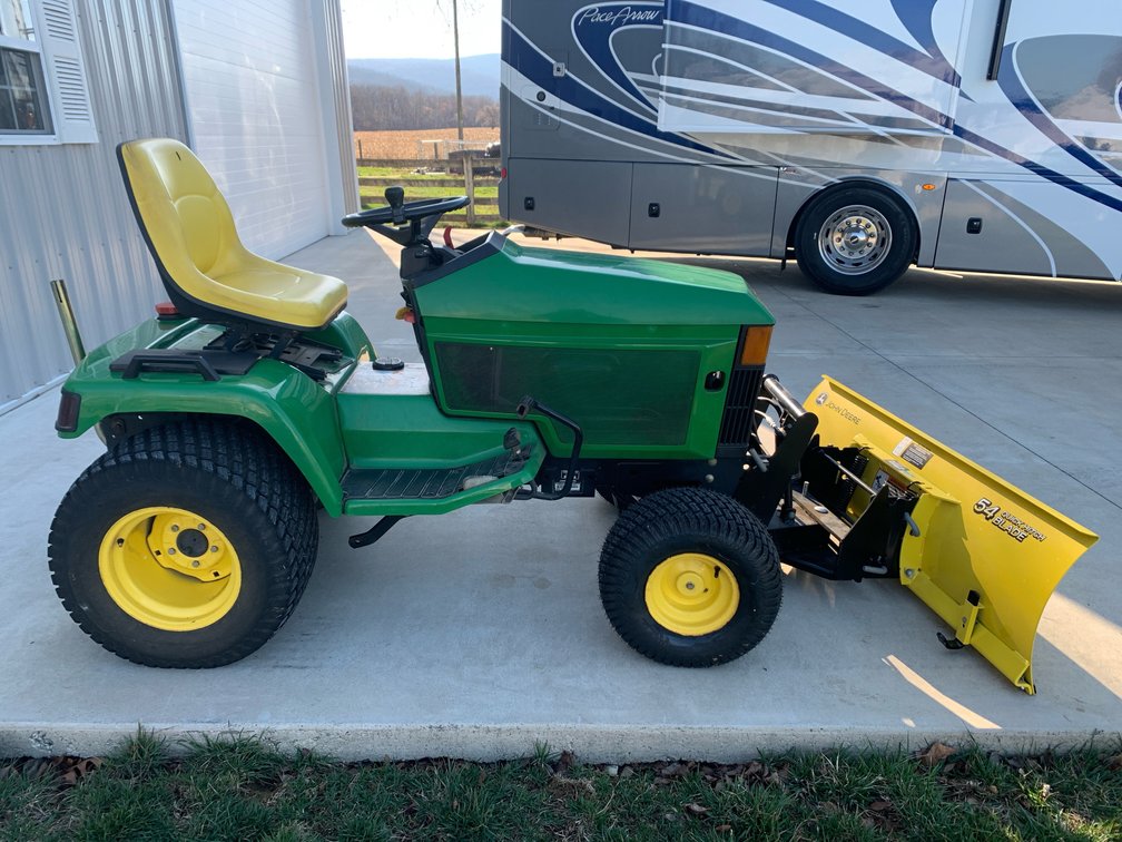 John Deere 455 Diesel With 60” Mowing Deck and Hydraulic Controlled Snow Blade.