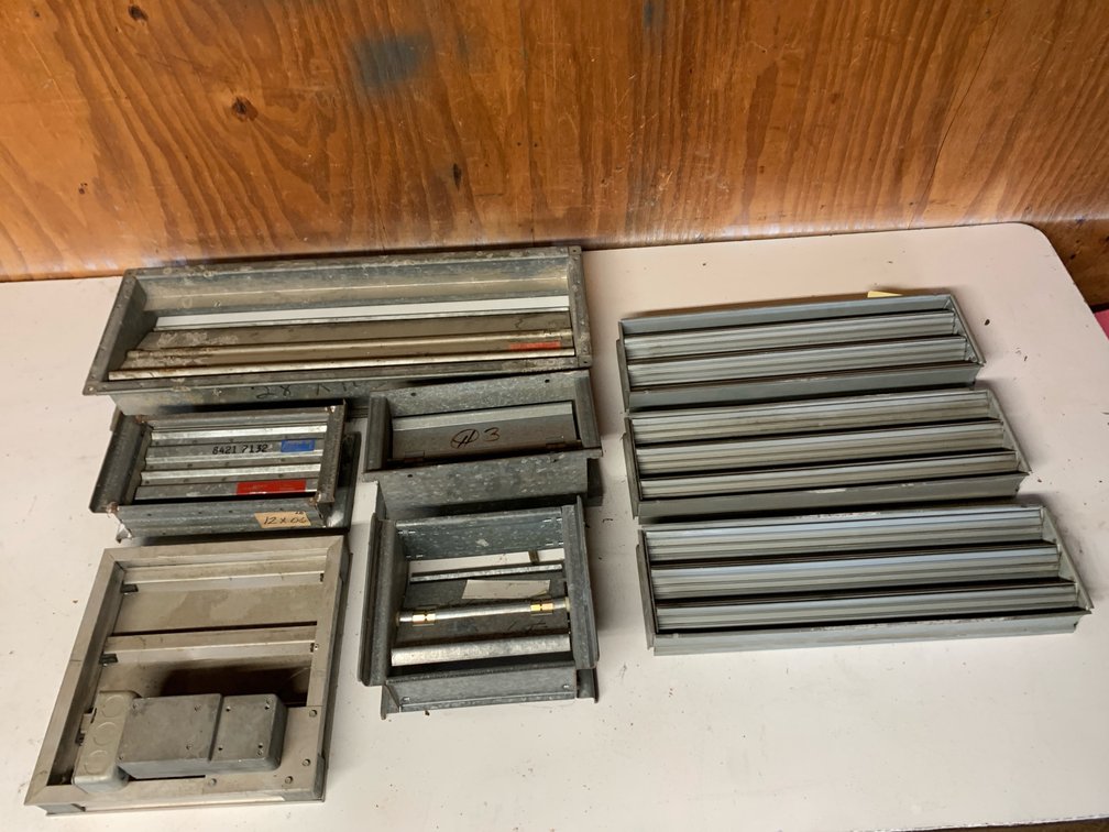 Assortment Of Dampers. Three Are 19 3/4”x6”. One Is 9 3/4”x27 3/4”. Two Are 11 7/8”x6”. One Is 11 3/4”x11 3/4”. One Is 9 7/8”x 7 3/4”