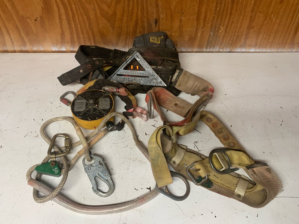 Four Safety Harness Pieces and A Cat Tool Bag