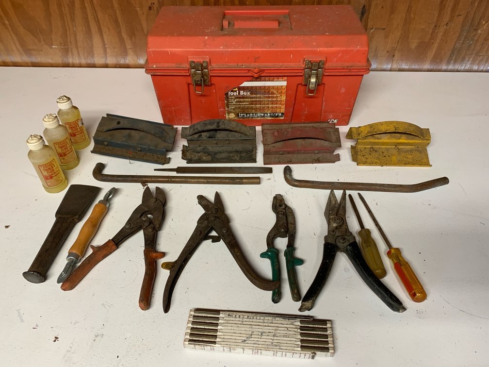 Assorted Sheet Metal Tools In A Plastic Tool Box