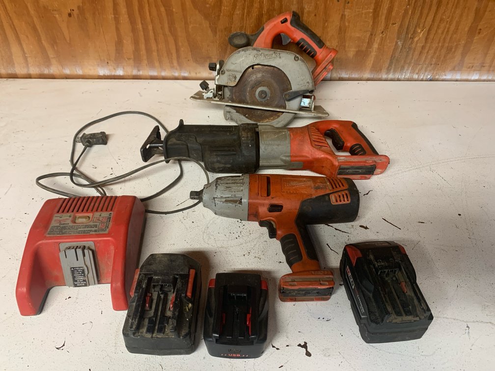 Milwaukee 28V Tool Kit With Skillsaw, Reciprocating Saw, Impact, Charger, Two Batteries, and An 18 Volt Battery Converter