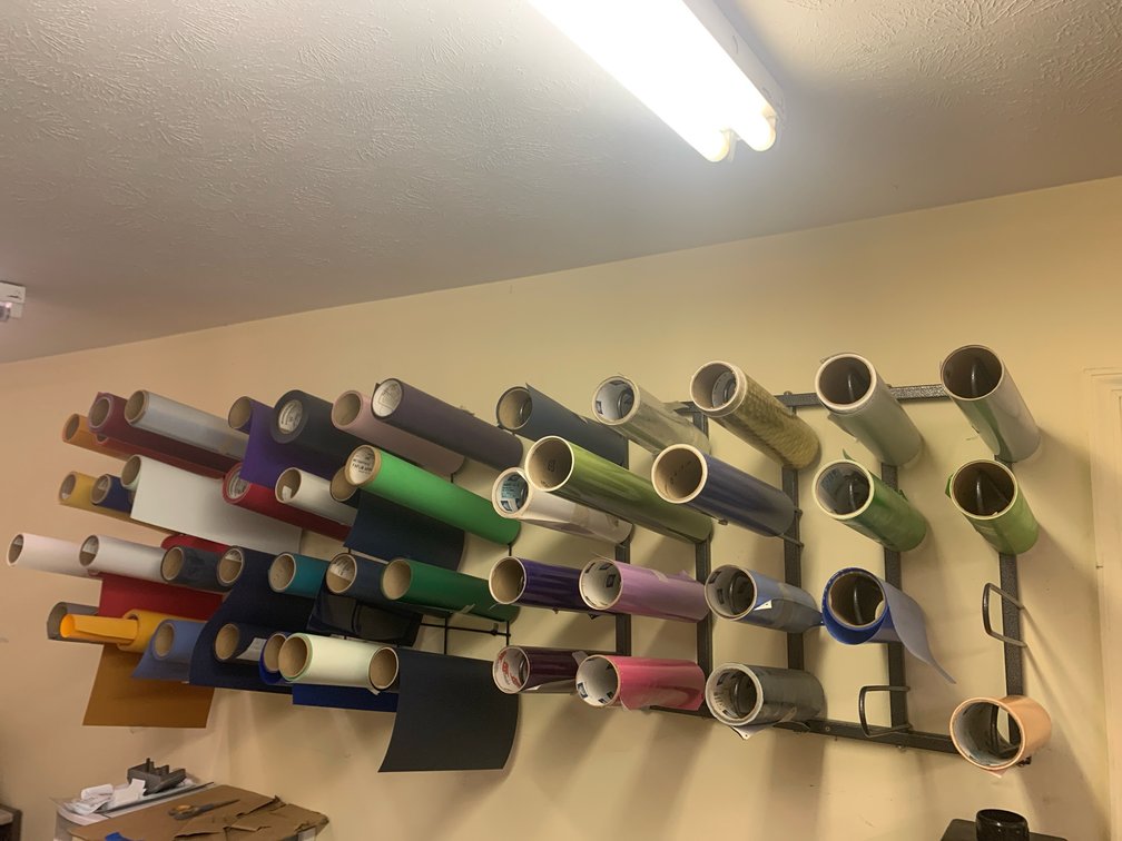 Three Racks Of Assorted Material For A Plotter. 15”, 20” and 24”. Racks Are Included