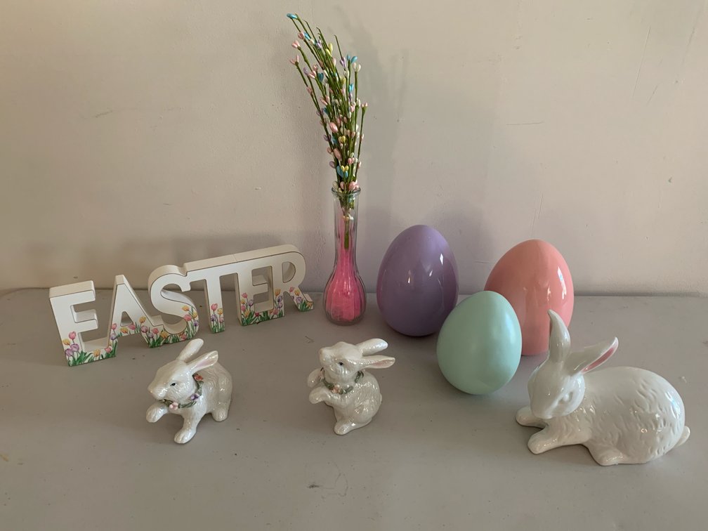 Easter Sign, Ceramic Rabbit Figurines, and Decorative Eggs