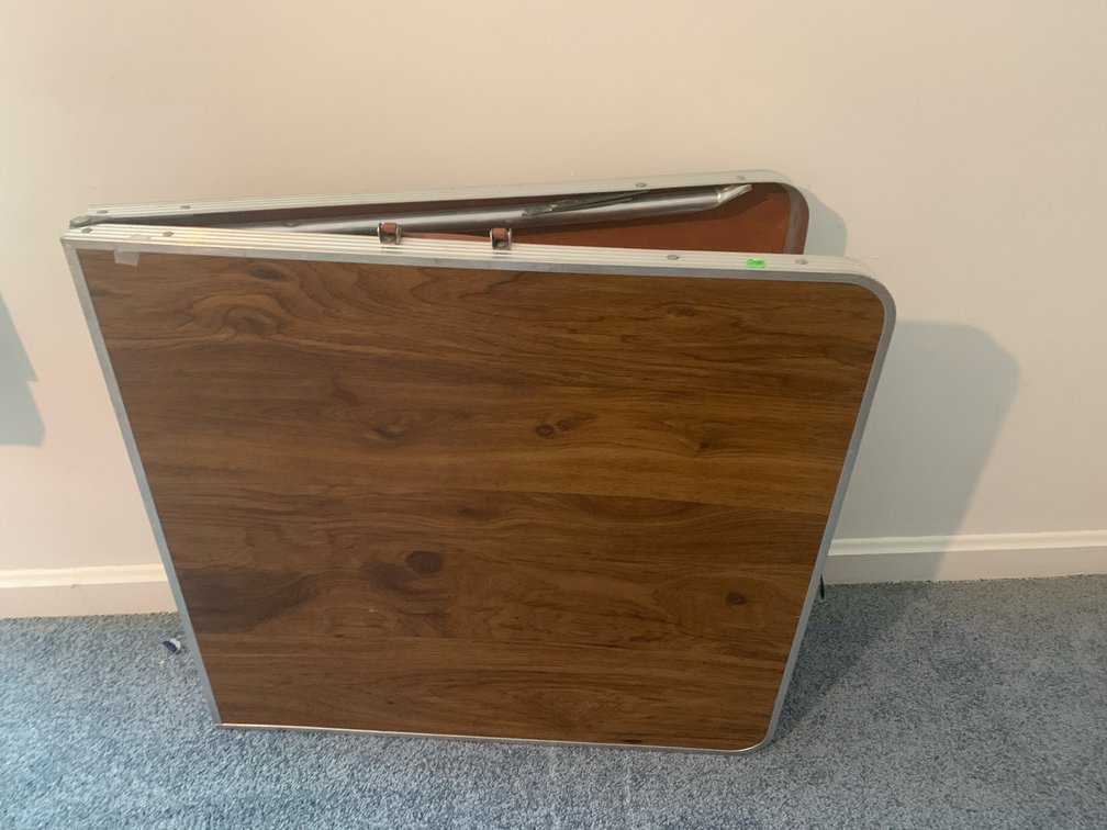 Bi-Fold Utility Table with Woodgrain Top and Aluminum Frame