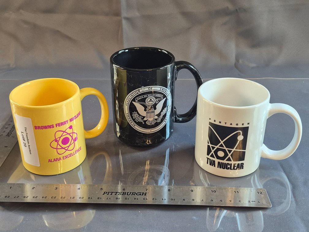 Three Nuclear-Themed Promotional Coffee Mugs