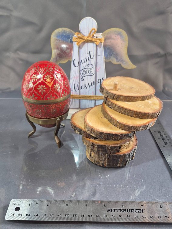 Decorative Angel Plaque, Red Brass Egg with Stand, and Wooden Slices Set