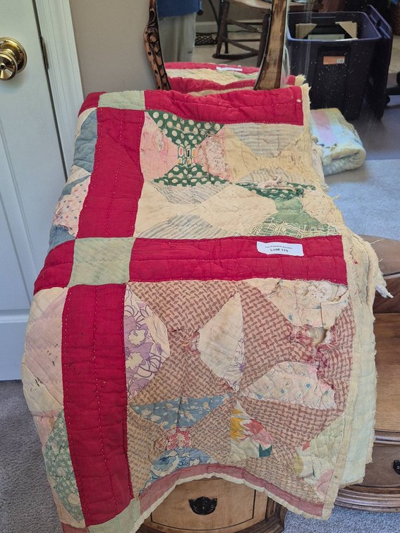 Handmade Patchwork Quilt with Multicolor Patterns and Red Borders