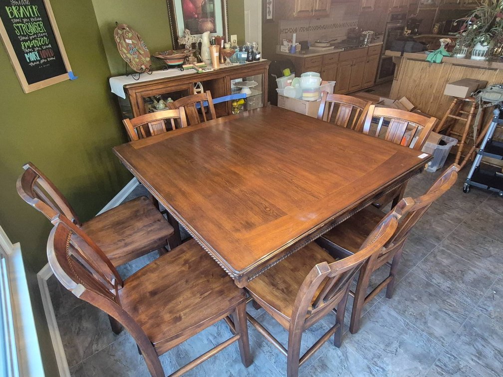 Wooden Dining Table with Eight Chairs and Decorative Backrests