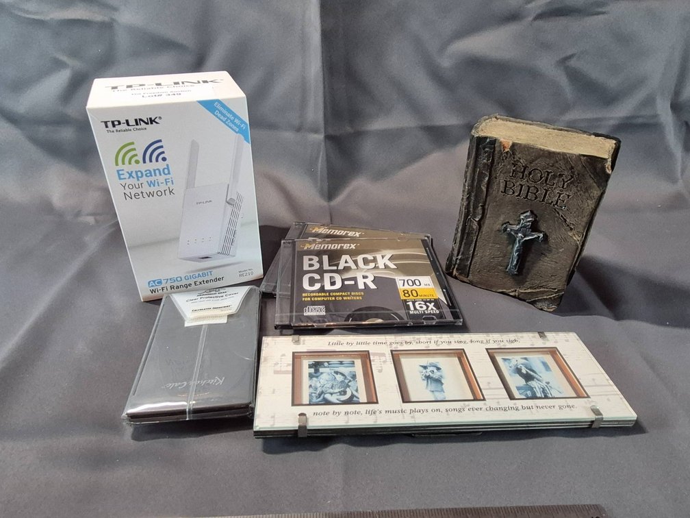Electronics and Decor Including Wi-Fi Extender, CD-Rs, and Holy Bible