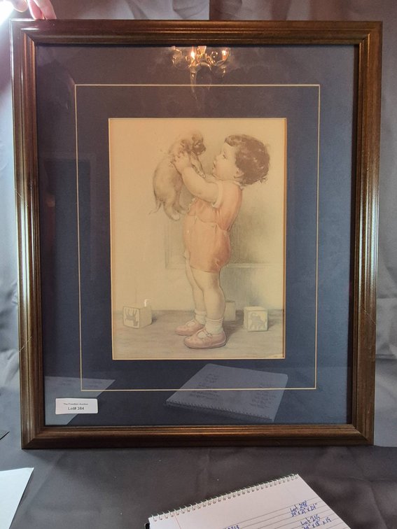 Framed Artwork of Child Holding a Puppy with Toy Blocks