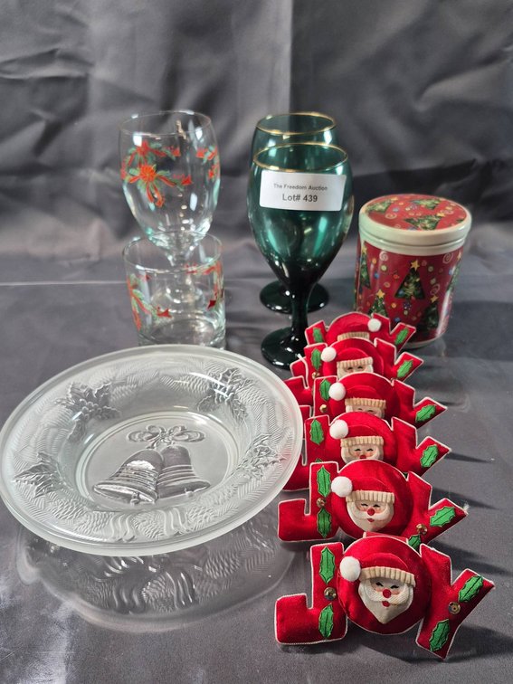 Festive Holiday Lot Featuring Glassware, Plate, Napkin Rings, and Tin