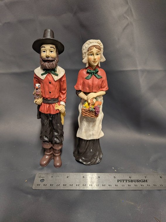 Male and Female Pilgrim Figurines in Traditional Attire
