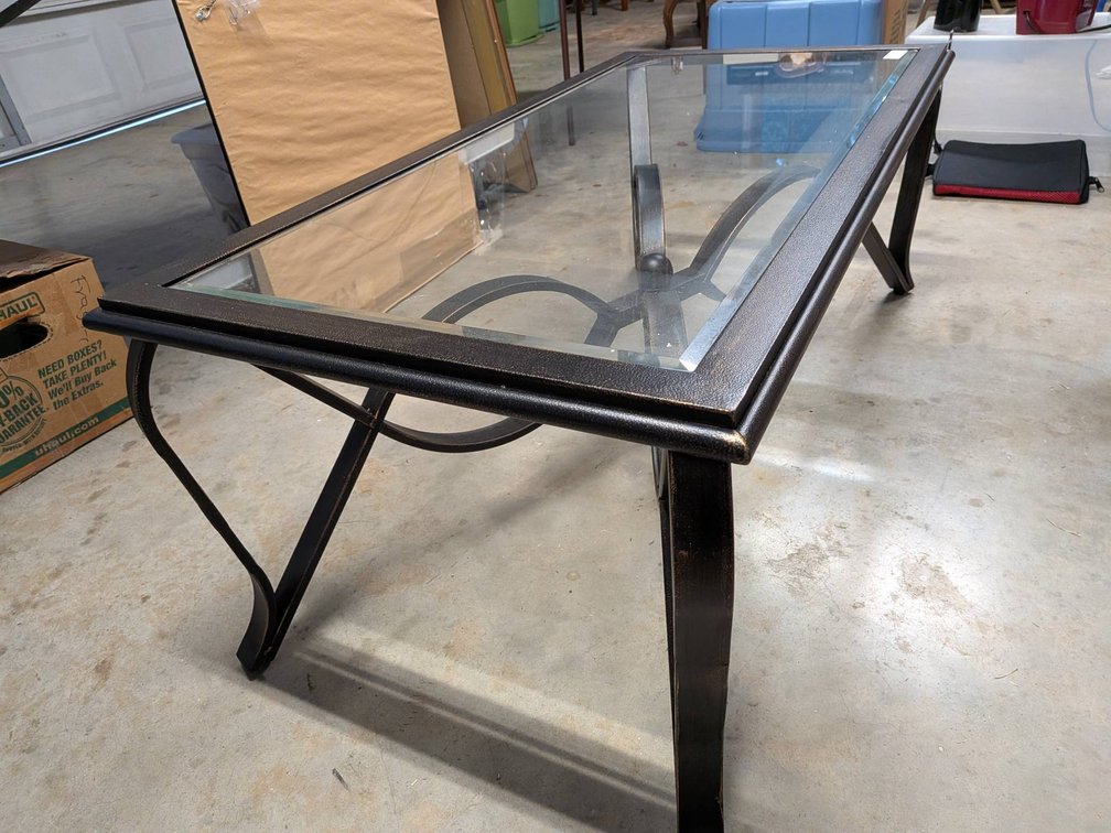 Rectangular Glass-Top Coffee Table with Metal Frame and Decorative Base