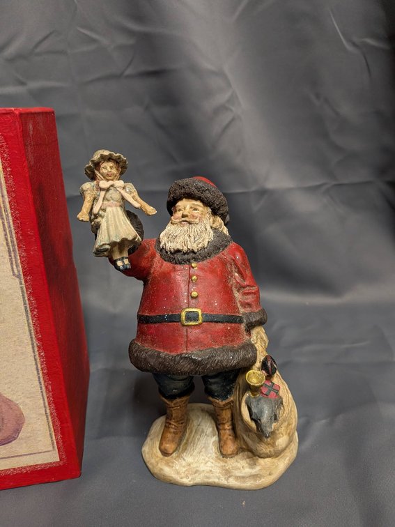 Hand-Painted Santa Claus Figurine with Angel Ornament and Gift Box