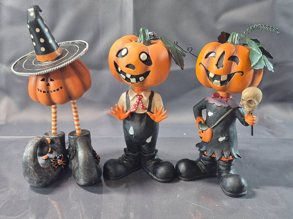 Three Halloween-Themed Pumpkin Head Figurines