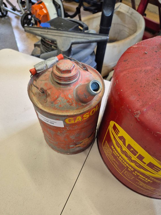 Two Metal Gasoline Cans Including Eagle Brand