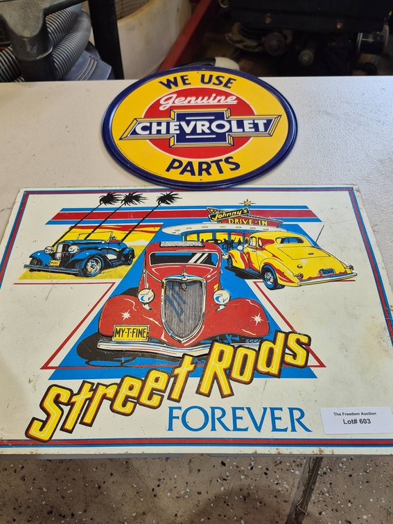 Two Tin Signs: 'Genuine Chevrolet Parts' and 'Street Rods Forever'
