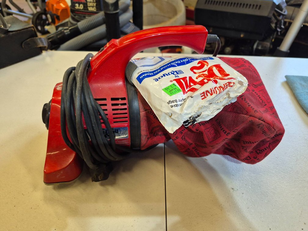 Red Dirt Devil Handheld Vacuum Cleaner with Attached Dust Bag