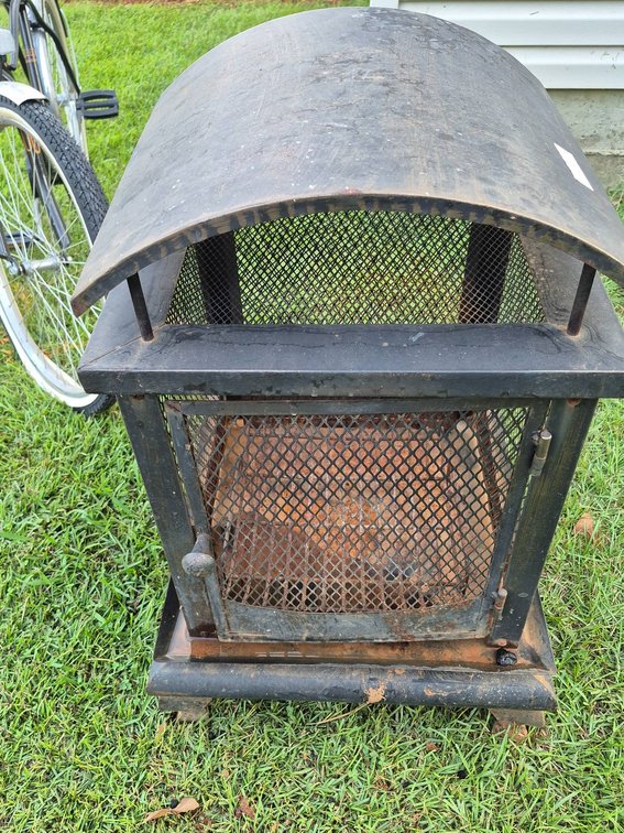 Metal Outdoor Wood-Burning Fire Pit with Mesh Sides and Curved Roof