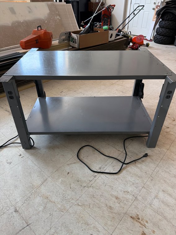 Metal table with electrical outlets