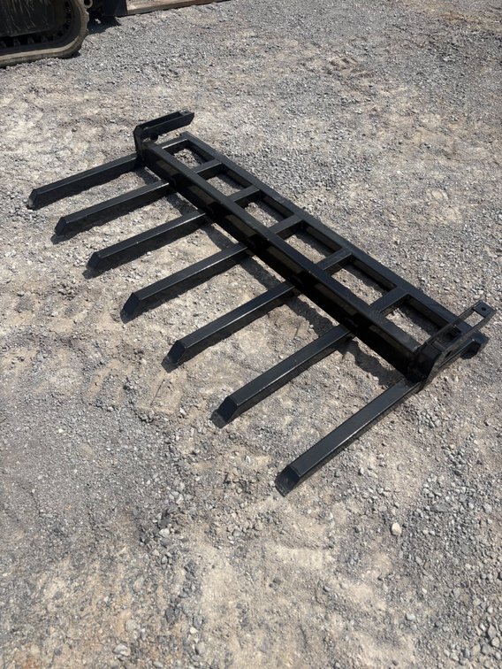 Bucket attached debris forks