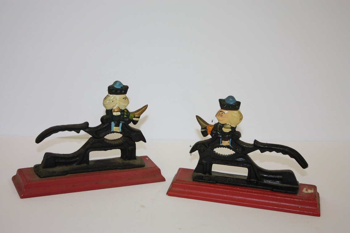 Lot Of Two Vintage Cast-Iron Soldier Nutcrackers Mounted On Red
