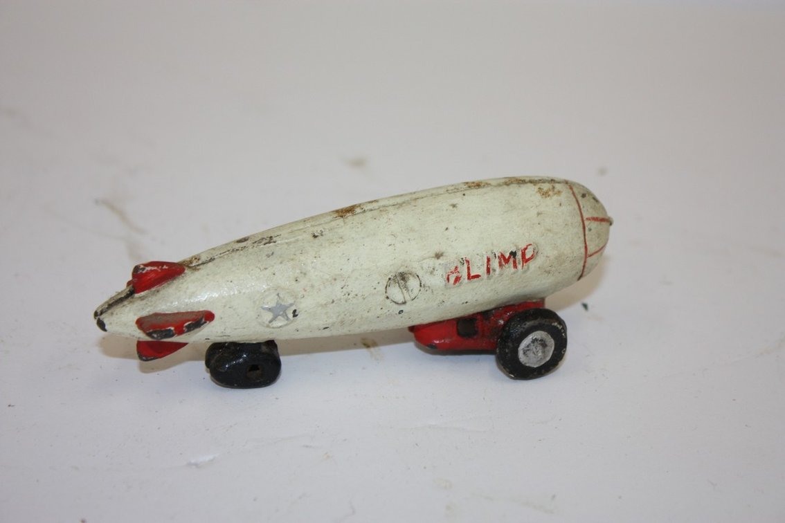 Vintage Cast-Iron White And Red Blimp Pull Toy