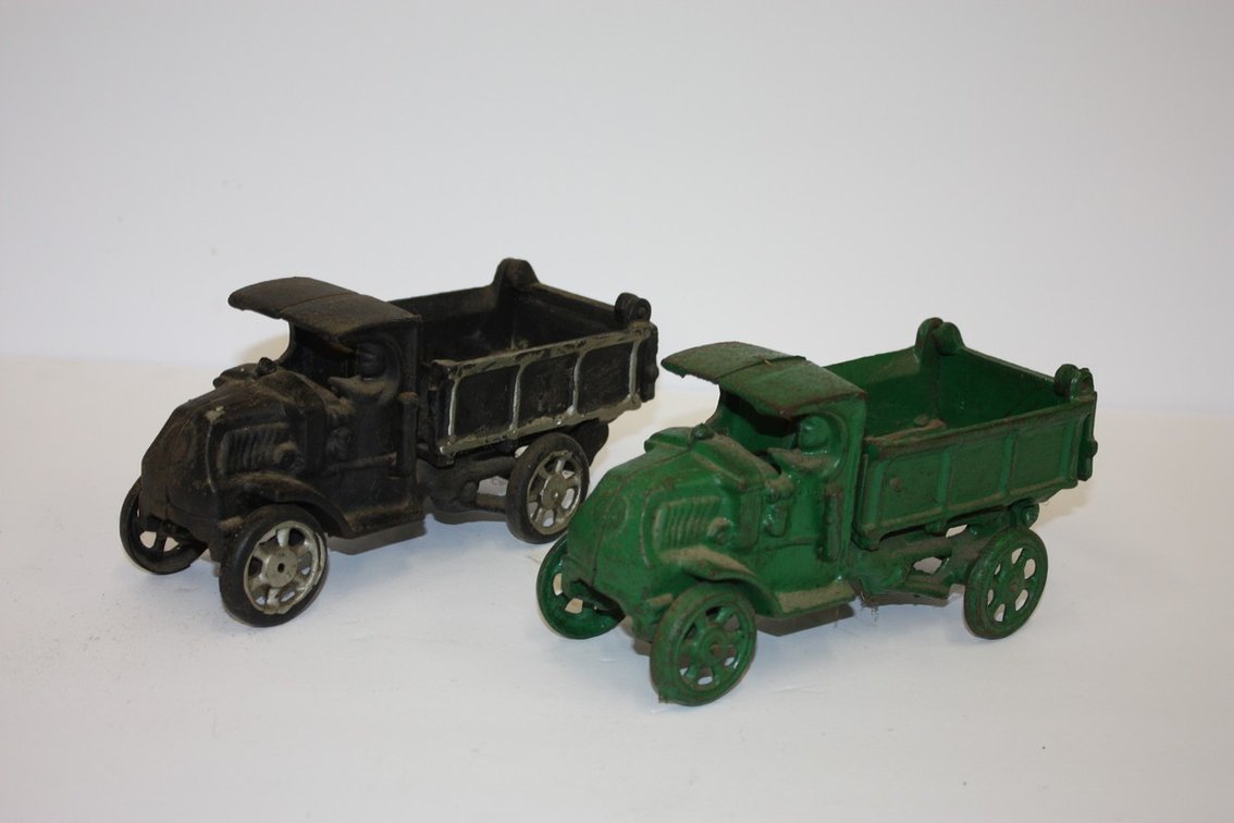 Vintage Cast-Iron Toy Dump Truck And One Reproduction