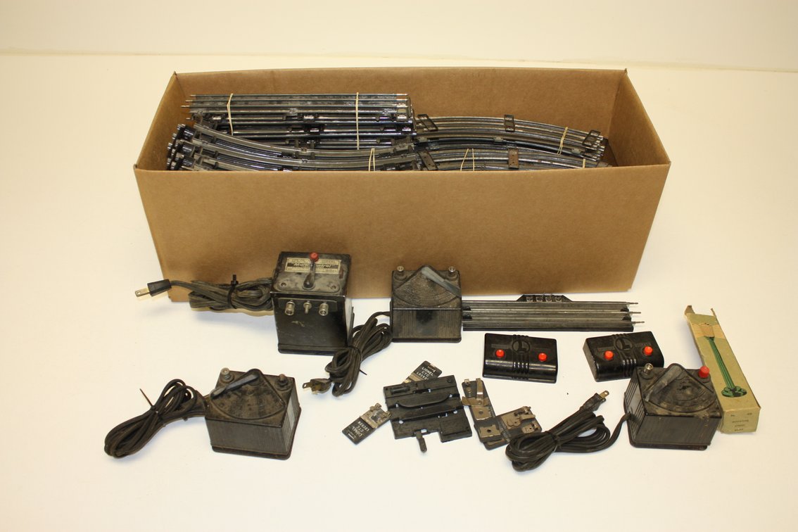MASSIVE LOT OF LIONEL TRAIN TRACK, SWITCHES, CROSSINGS, TRANSFORMERS, AND MORE!