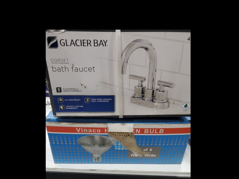 Lot 31: New bath faucet and light bulbs