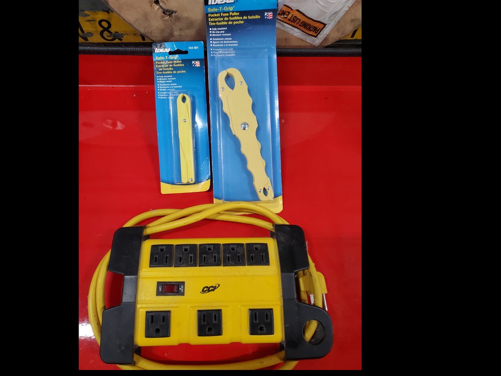 Lot 63: Power strip and fuse pullers