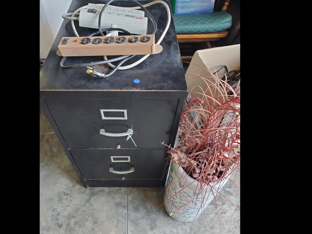 Lot 120: 2 drawer file cabinet,power strips and decor