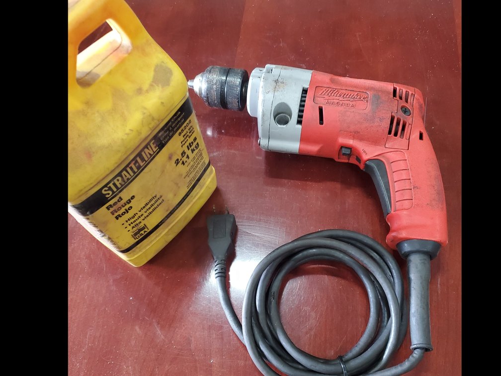 Lot 127: Milwaukee drill and full bottle marking chalk