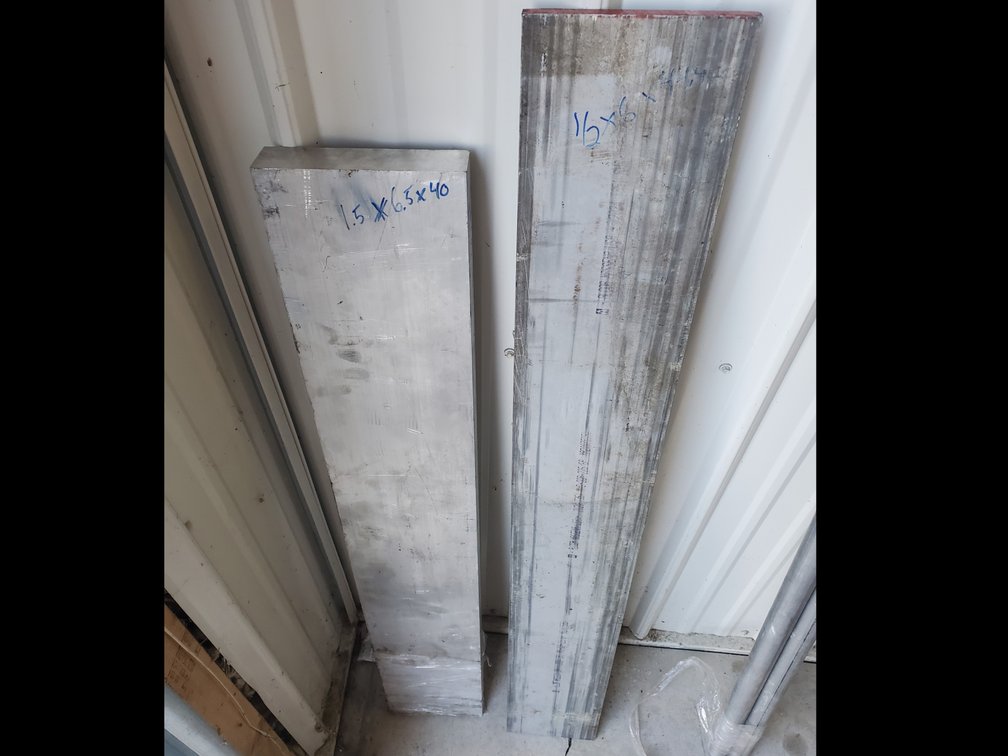 Lot 104: 1.5 inch thick solid aluminum and 1/2 aluminum