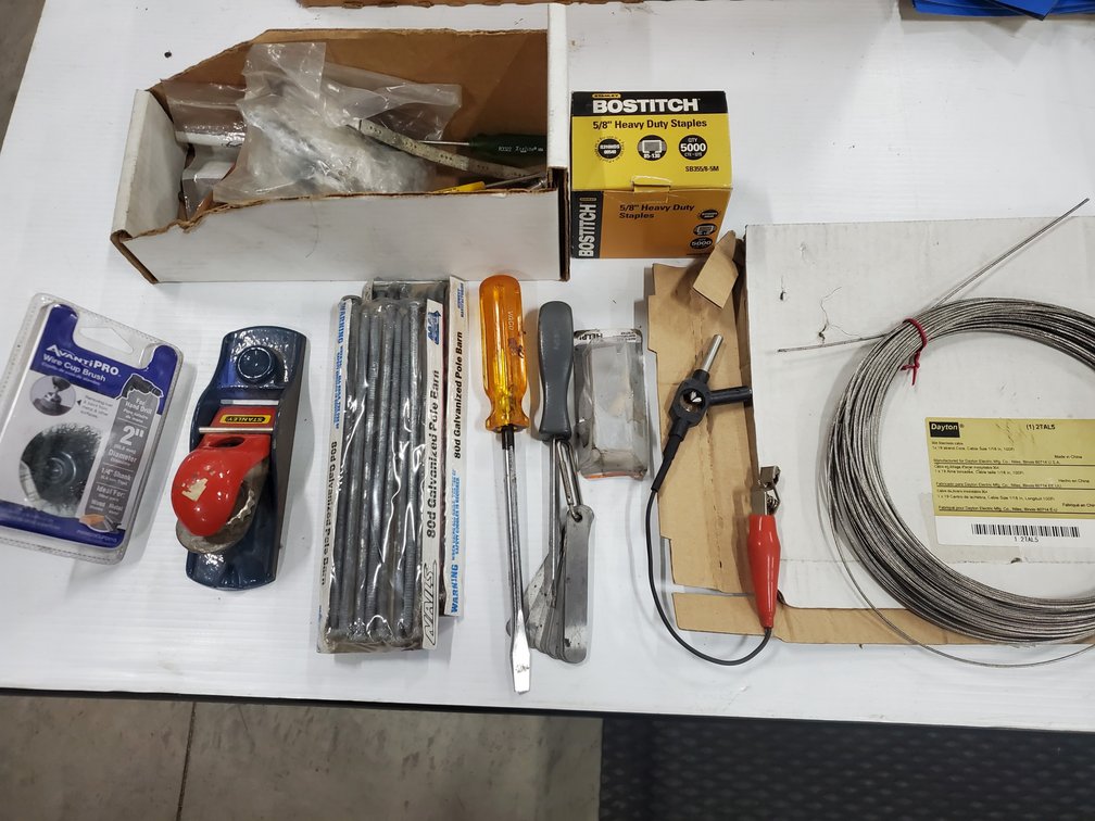 Lot 173: Full box of staples, ss wire,tools and hardware