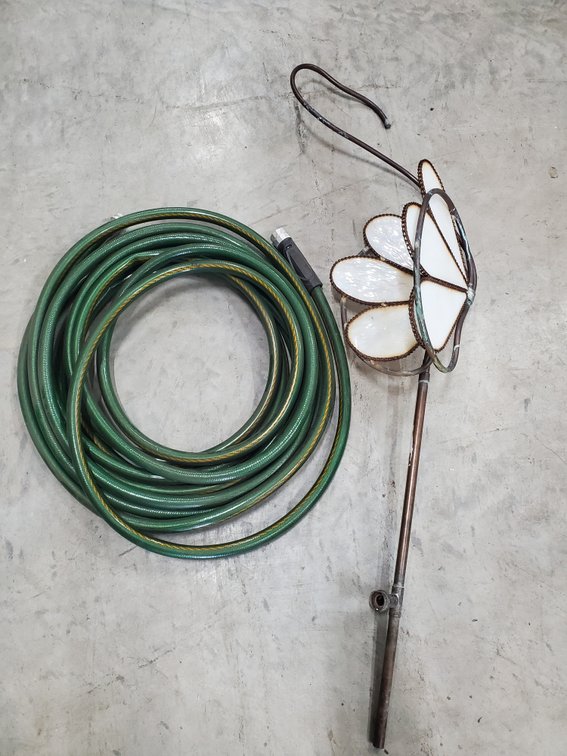 Lot 121: Garden hose and lawn ordernment