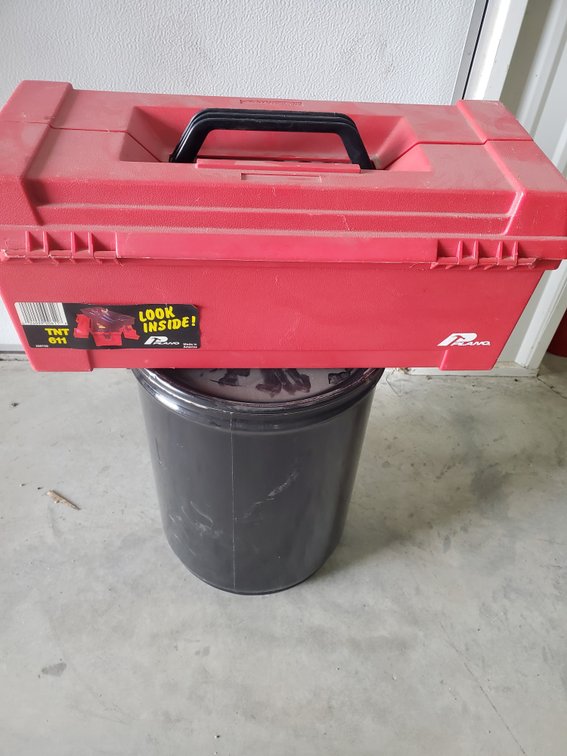 Lot 26: Tool box and 5 gallon pail with 5 gallon jub inside