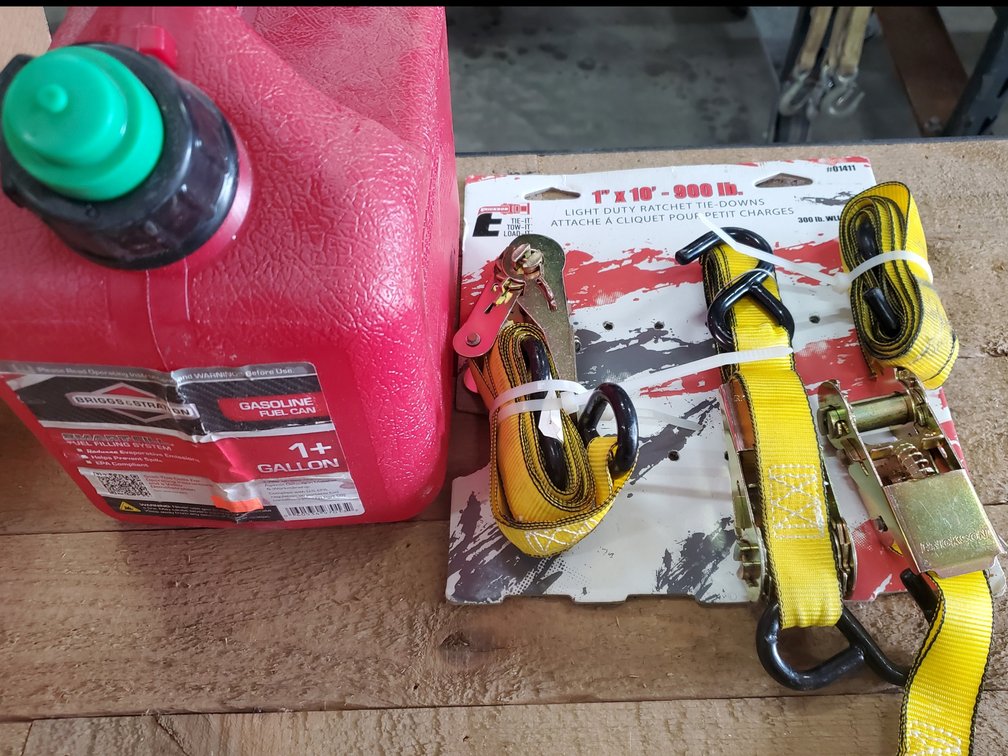 Lot 135: New gas can and ratchet straps