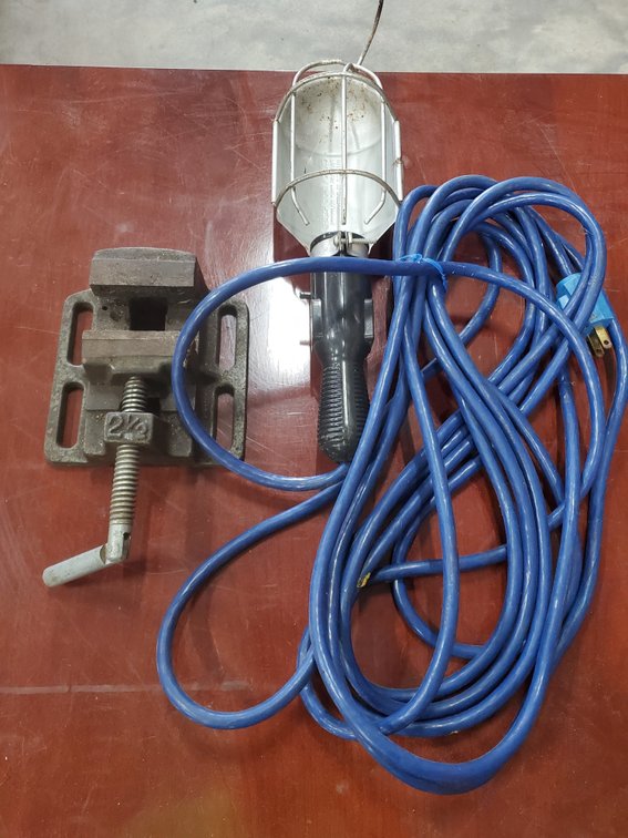 Lot 201: Small vise and trouble light