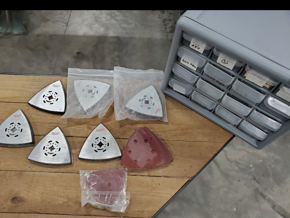 Lot 177: Milwaukee sanding mounts with pads and organizer