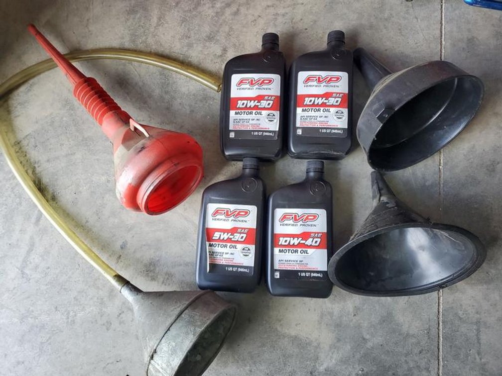 Lot 88: Assortment of FVP Motor Oil and Funnels