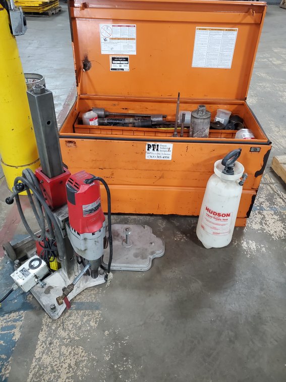 Lot 23: Milwaukee concrete/core drill with assortment of bits and job box