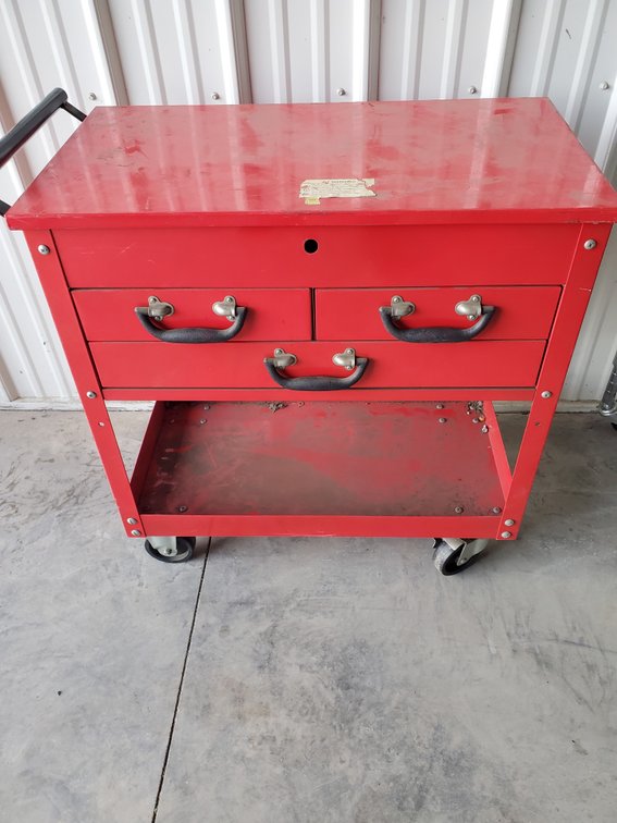 Lot 52: Red rolling tool box