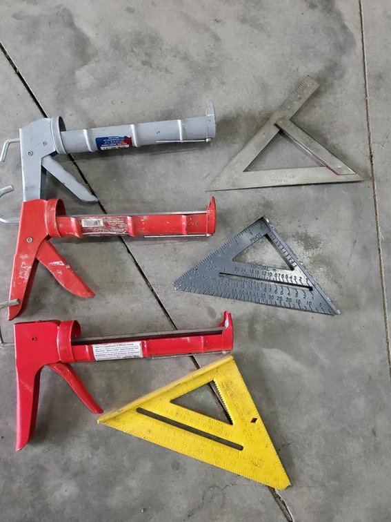 Lot 28: Assortment of Caulk Guns and Speed Squares