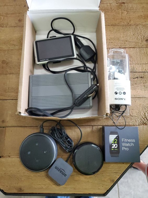 Lot 134: Amazon Echo Dot Garmin Nuvi Sony Earbuds Mixed Electronics Lot