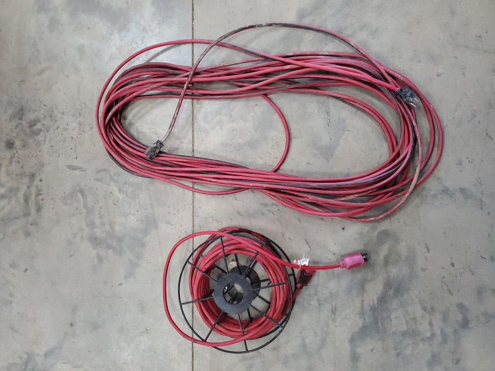 Lot 152: Pair of Heavy Duty Extension Cords Red Shop Cables on Reel Used