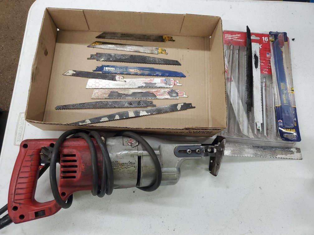 Lot 76: Milwaukee Sawzall Corded Reciprocating Saw w Assorted Blades
