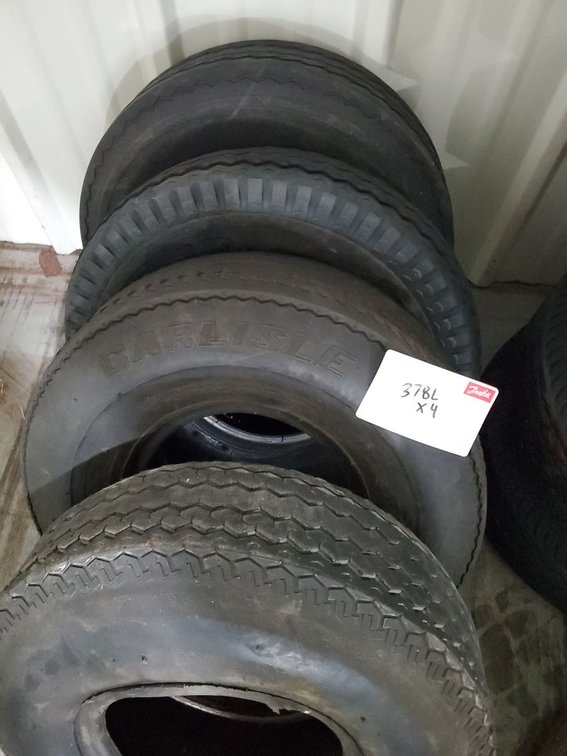 Lot 378L: Set of 4 Carlisle Trailer Tires Mixed Tread Used As-Is See Photos