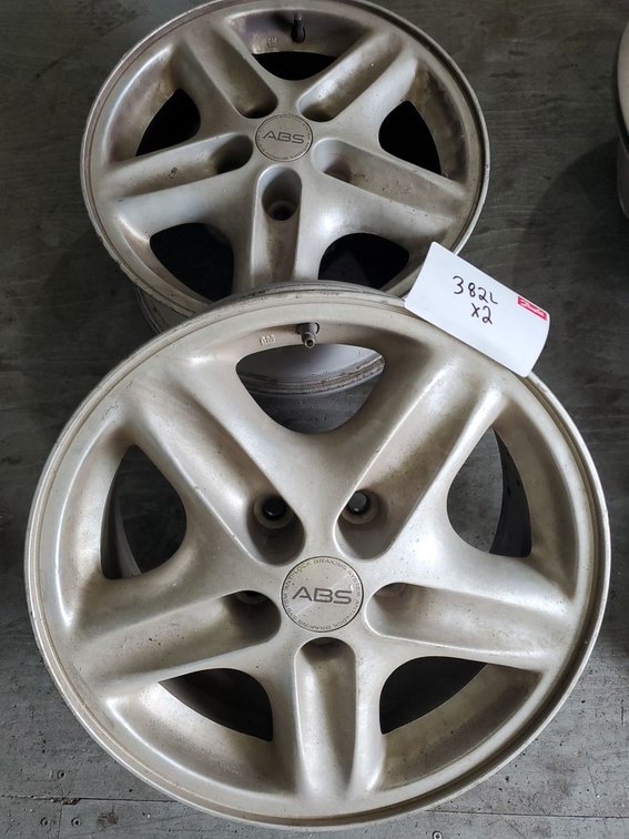 Lot 382L: Pair of GM 16in 5 Lug Alloy Wheels Factory Rims ABS Center Caps