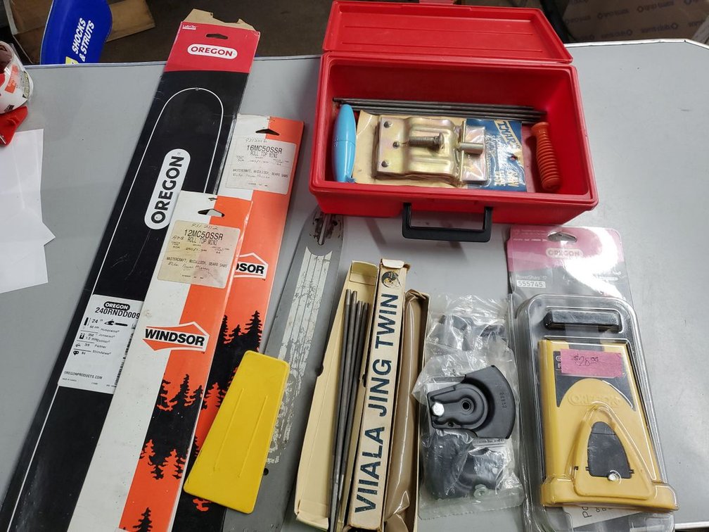 Lot 176: Chainsaw files and bars, misc parts